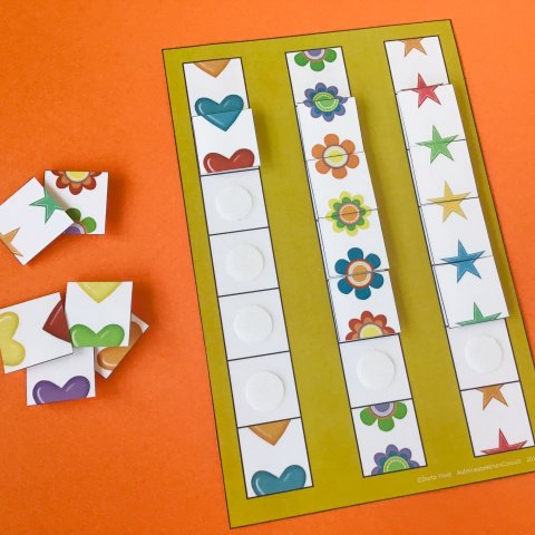 Domino med hjerter, blomster og stjerner